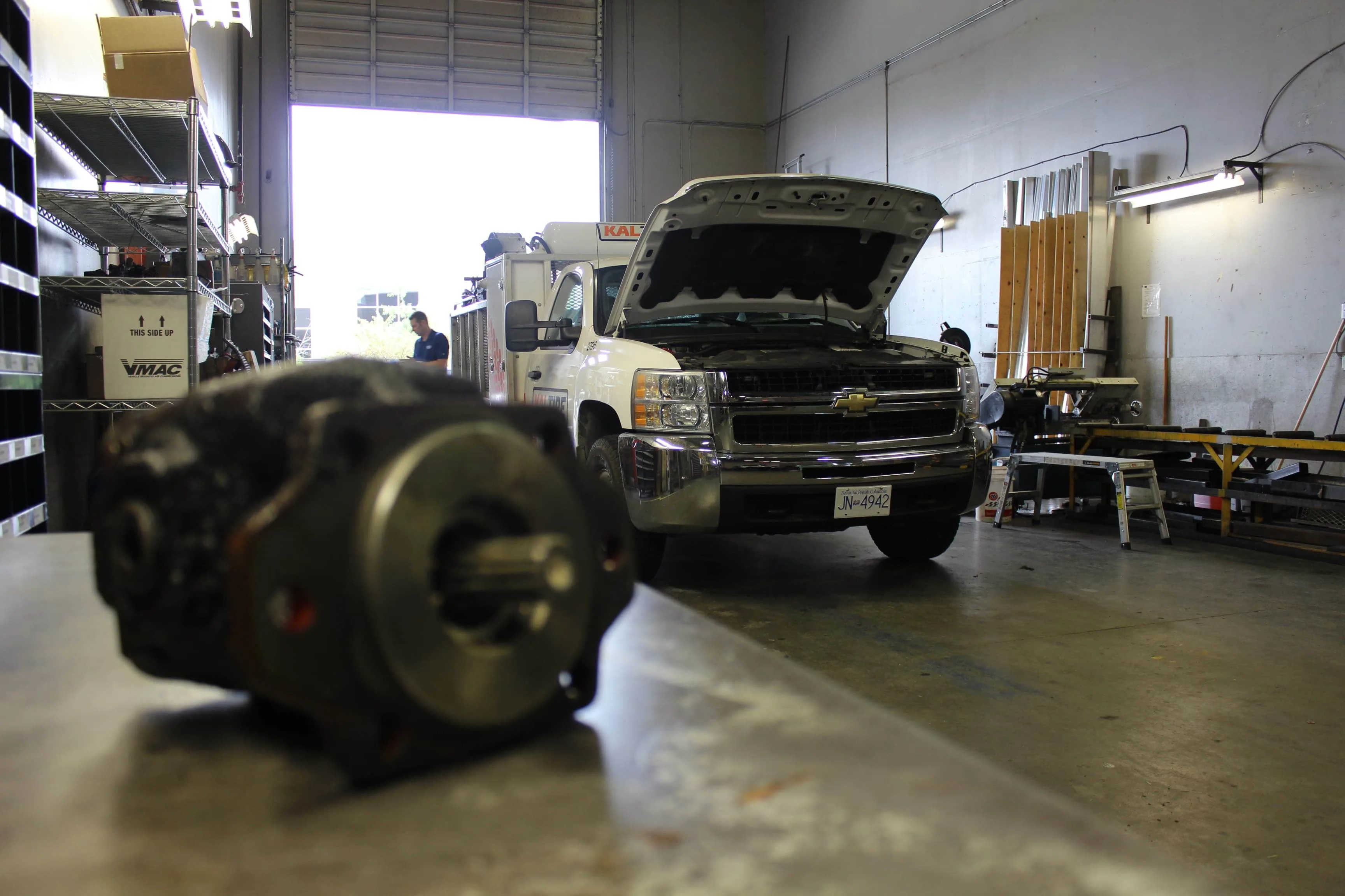 Work truck being repaired on in the shop